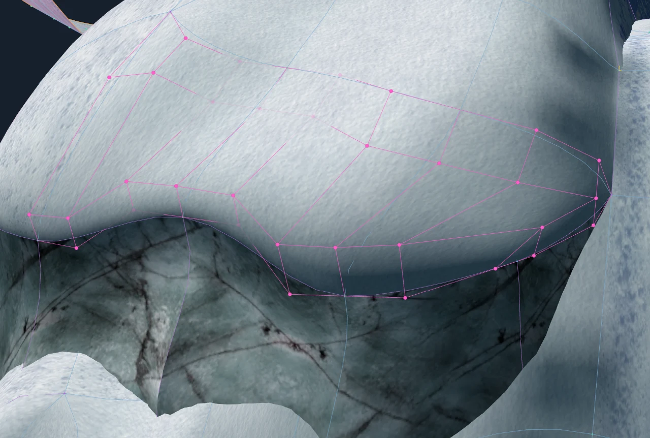 Magenta control-cage points shaping a rounded snow overhang above a rock wall.